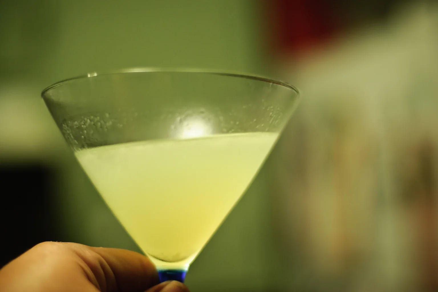A Last Word in a stemmed cocktail glass — pale green, condensation on the bowl