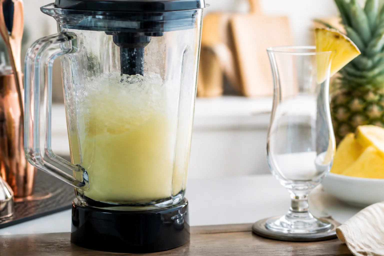 Blender with crushed ice making a frozen cocktail