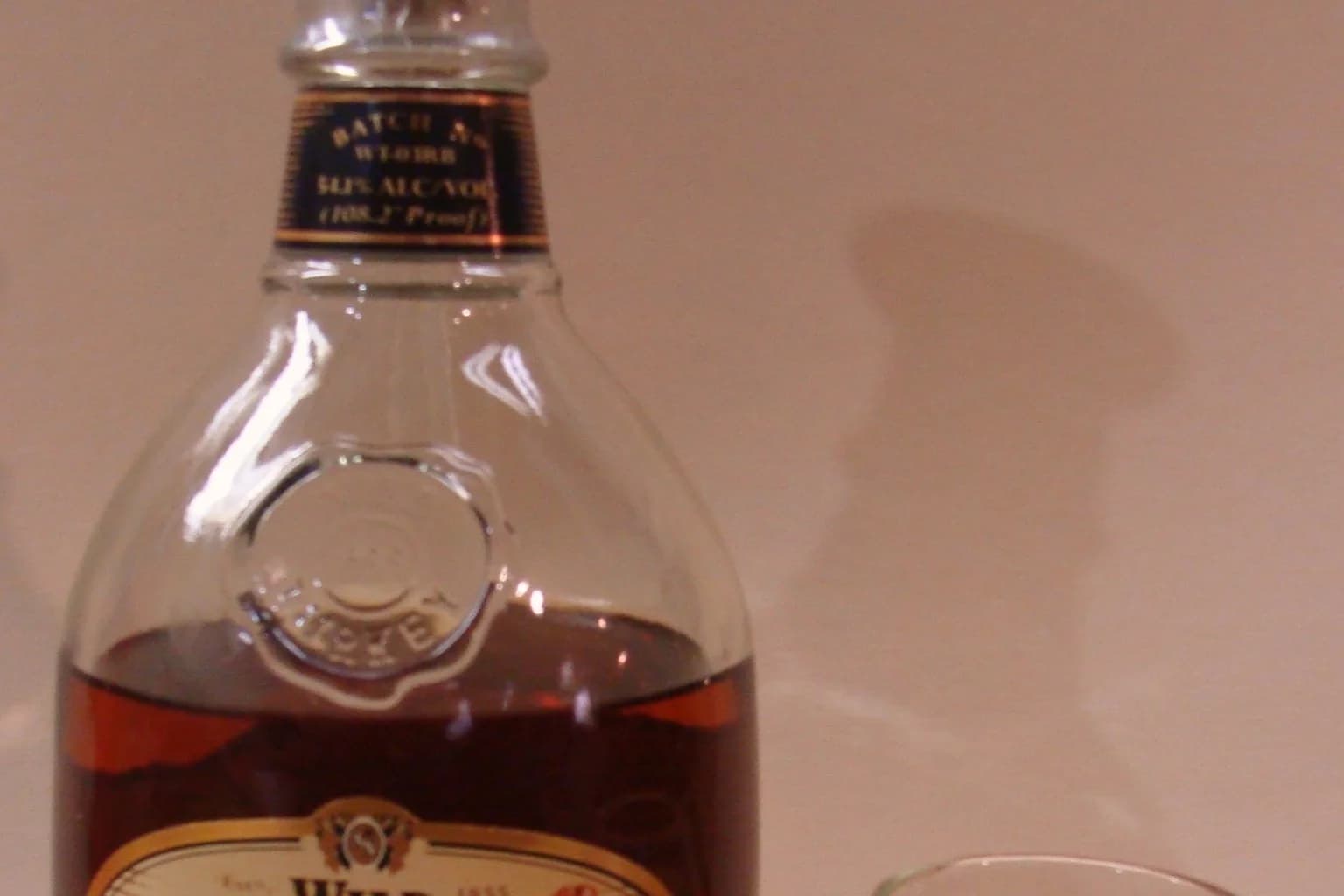 Wild Turkey Rare Breed bourbon bottle showing Kentucky straight bourbon whiskey and barrel proof on the label