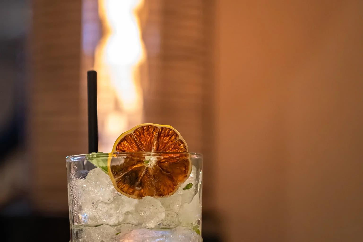 A mint highball packed with crushed ice and fresh mint