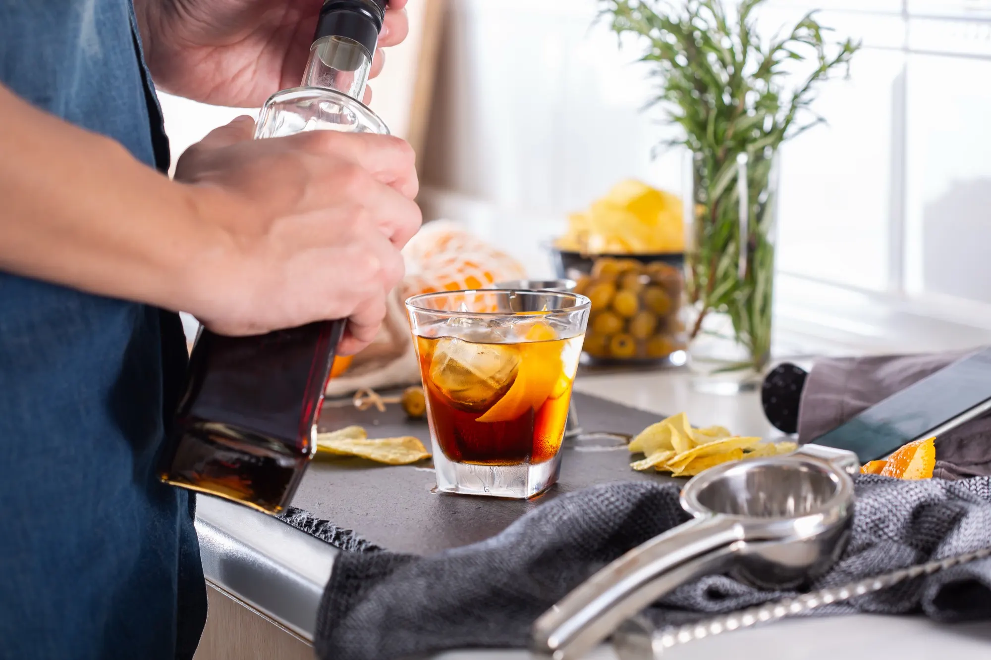 Making an Old Fashioned at a home bar