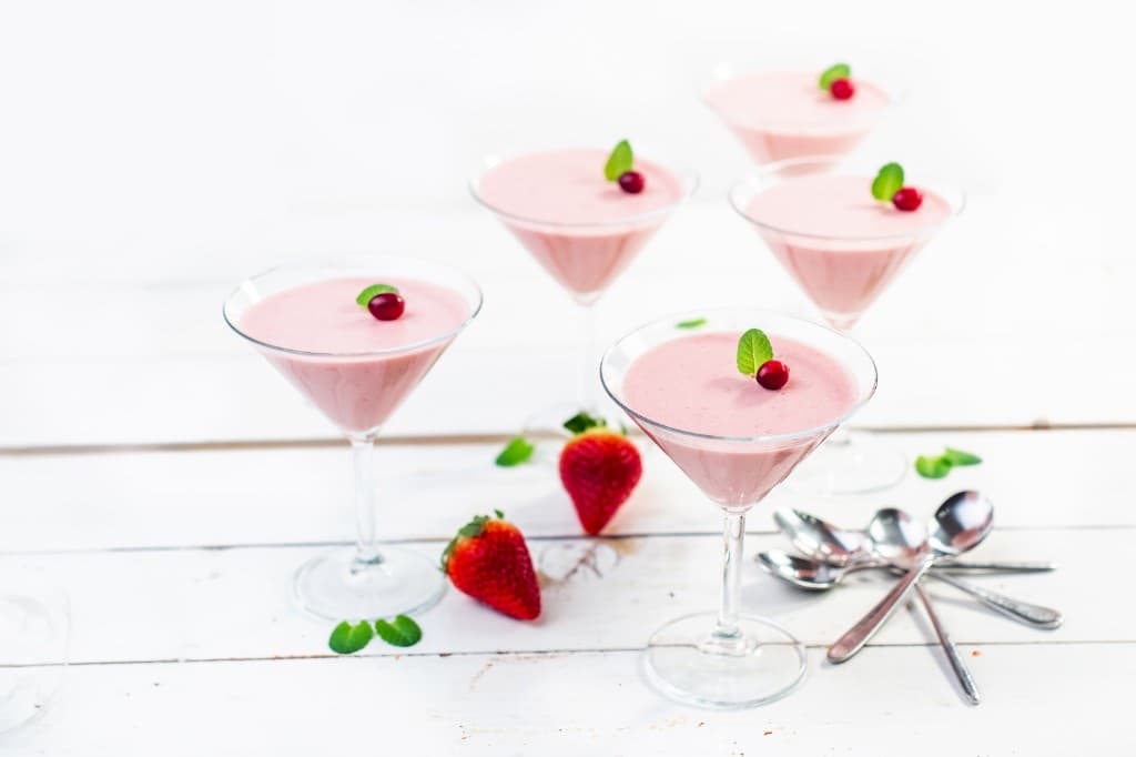 Pink Lady served in a chilled coupe, pale pink with foam, no heavy garnish.