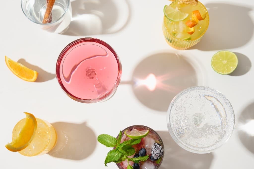 Virgin Mojito in a highball over ice, pale, mint sprig bouquet.