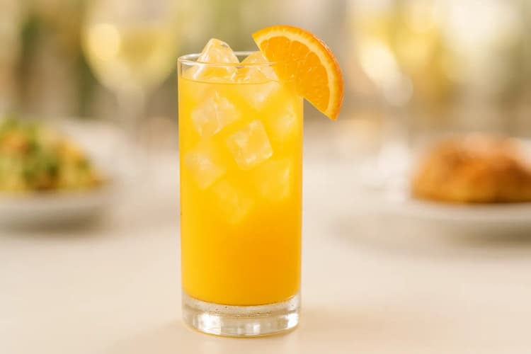 A Screwdriver with vivid orange color and an orange wedge.