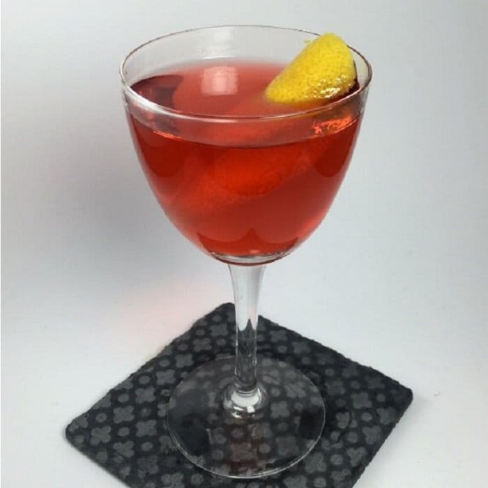 An Old Pal served up in a coupe with a thin lemon twist ribbon resting on the rim.