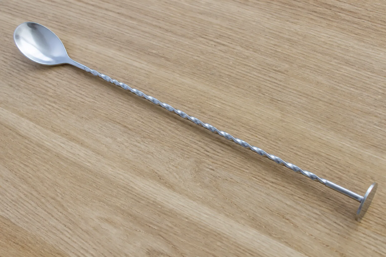 Twisted bar spoon on a kitchen counter