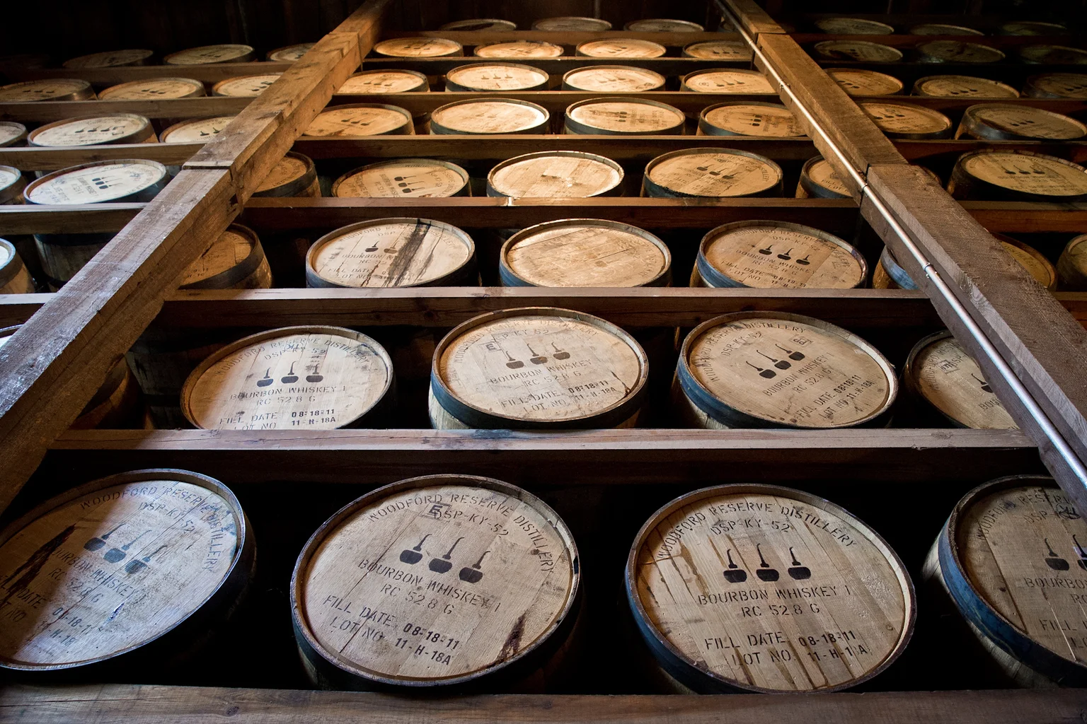 Bourbon barrels aging in a wooden rickhouse at Woodford Reserve, Kentucky